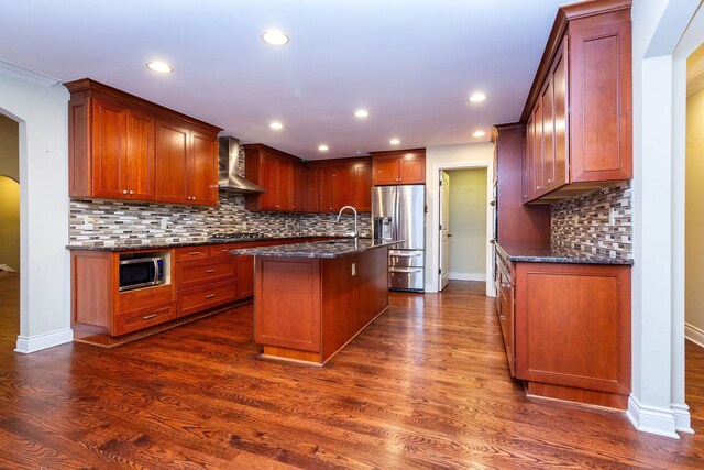 4345 Pine Tree Trl, Bloomfield Hills, MI 48302 - kitchen featuring stainless steel appliances, wall chimney exhaust hood, a center island with sink, dark stone countertops, and backsplash