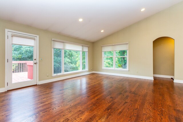 4345 Pine Tree Trl, Bloomfield Hills, MI 48302 - unfurnished room with plenty of natural light, arched walkways, lofted ceiling, dark wood-style flooring, and recessed lighting