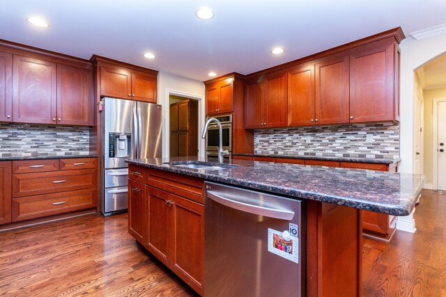 4345 Pine Tree Trl, Bloomfield Hills, MI 48302 - kitchen featuring appliances with stainless steel finishes, a sink, wood finished floors, recessed lighting, and backsplash
