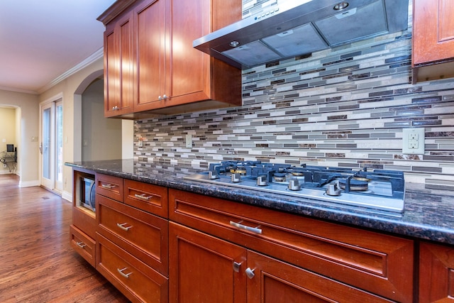 4345 Pine Tree Trl, Bloomfield Hills, MI 48302 - kitchen with extractor fan, appliances with stainless steel finishes, crown molding, arched walkways, and backsplash