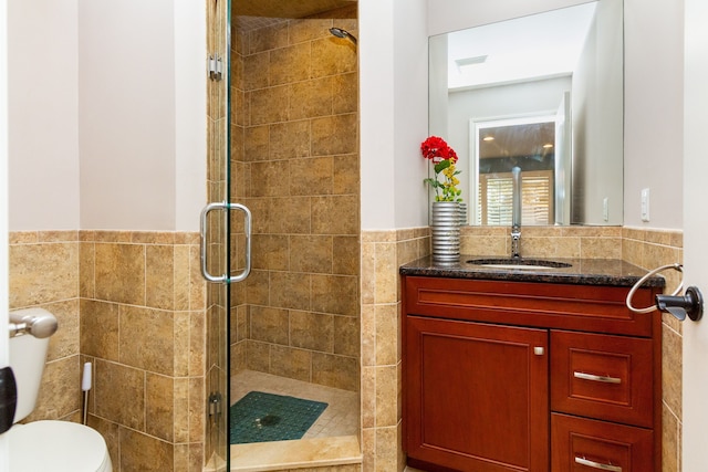 4345 Pine Tree Trl, Bloomfield Hills, MI 48302 - full bath featuring tile walls, a shower stall, vanity, toilet, and wainscoting