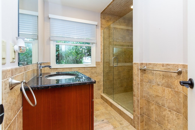 4345 Pine Tree Trl, Bloomfield Hills, MI 48302 - bathroom with tile walls, a stall shower, vanity, a wainscoted wall, and tile patterned flooring