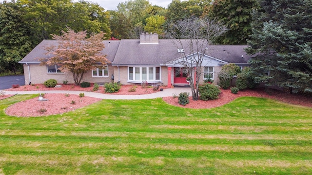 4345 Pine Tree Trl, Bloomfield Hills, MI 48302 - view of front facade featuring a chimney, a front lawn, and brick siding
