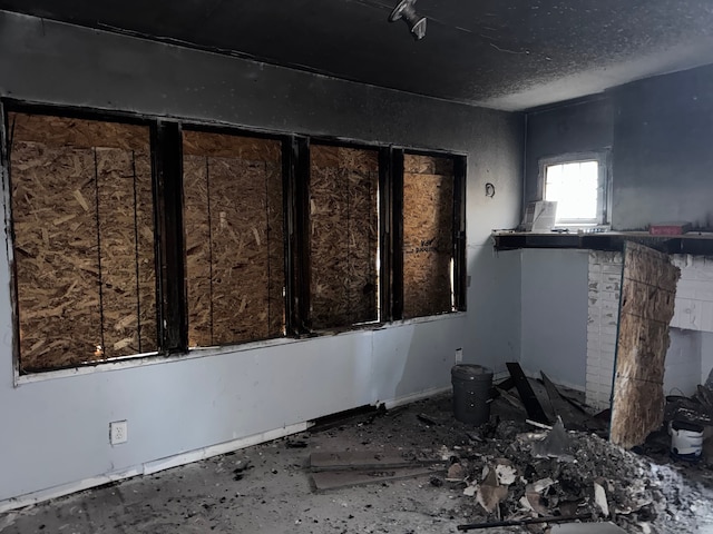 miscellaneous room featuring a textured ceiling