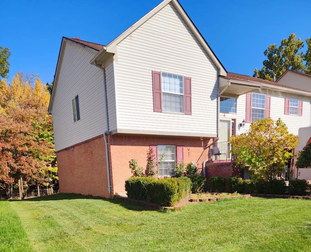 view of property exterior featuring a lawn