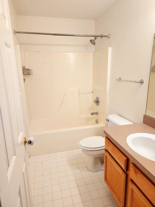 full bathroom with shower / tub combination, tile patterned floors, vanity, and toilet