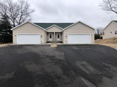 ranch-style home featuring a garage