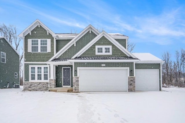 craftsman inspired home with a garage