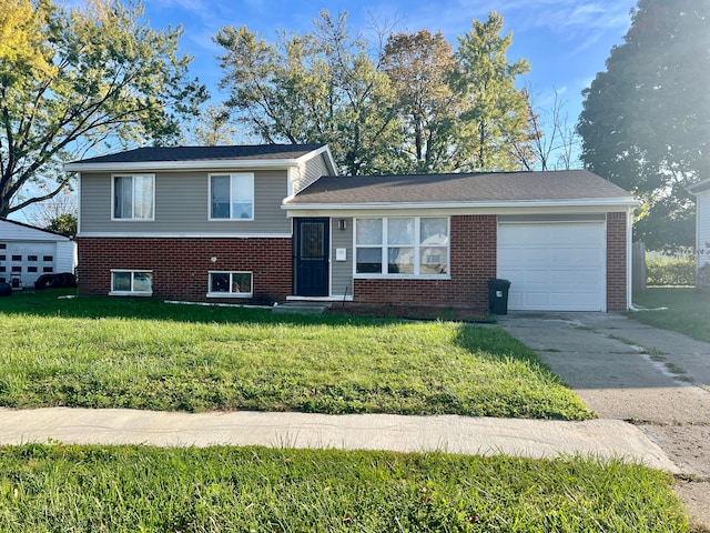 split level home with a front yard and a garage