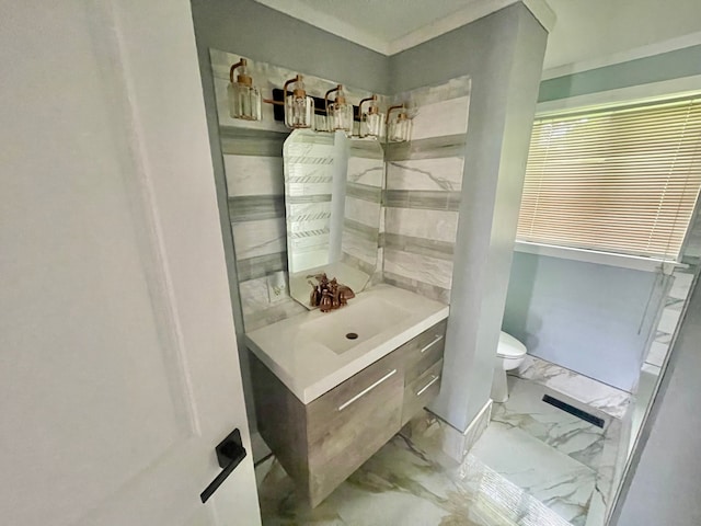 bathroom featuring vanity and toilet