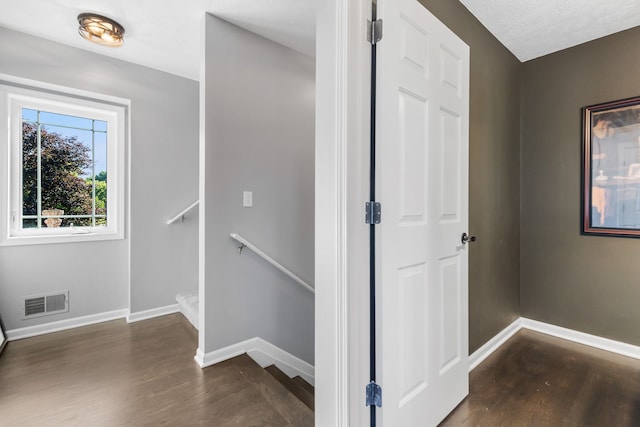 stairs with hardwood / wood-style flooring