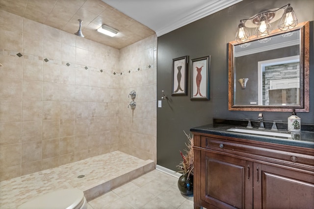 bathroom featuring tile patterned floors, tiled shower, toilet, vanity, and ornamental molding