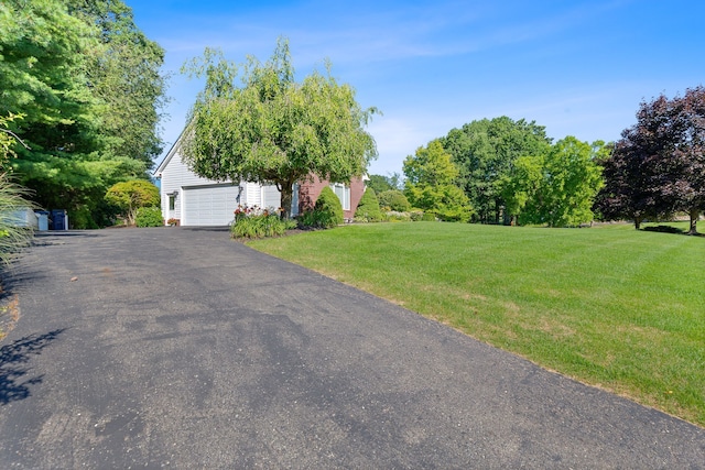 view of yard with a garage