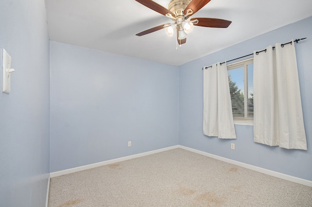 empty room with ceiling fan and carpet floors