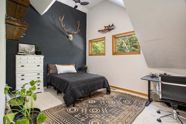 bedroom featuring carpet floors and vaulted ceiling