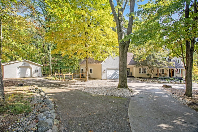 view of front of house featuring a porch and a garage