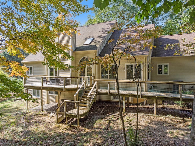 rear view of house with a deck