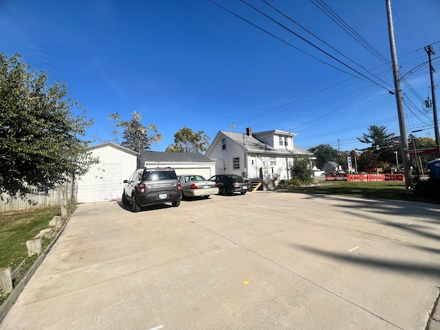 view of front facade featuring a garage and an outdoor structure