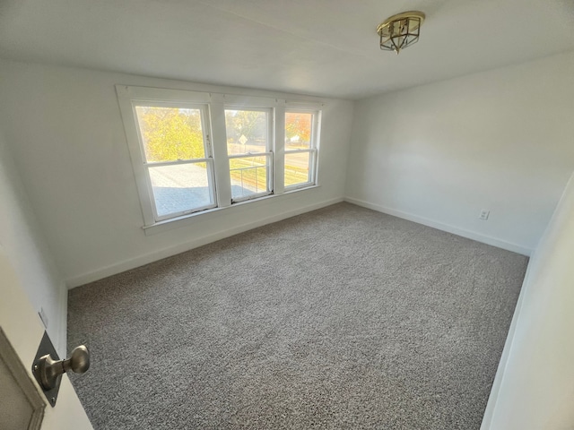 empty room with carpet flooring