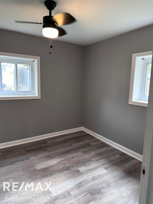 unfurnished room with wood-type flooring, plenty of natural light, and ceiling fan