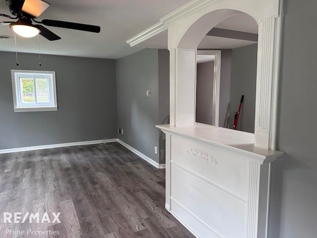 spare room featuring dark hardwood / wood-style flooring and ceiling fan