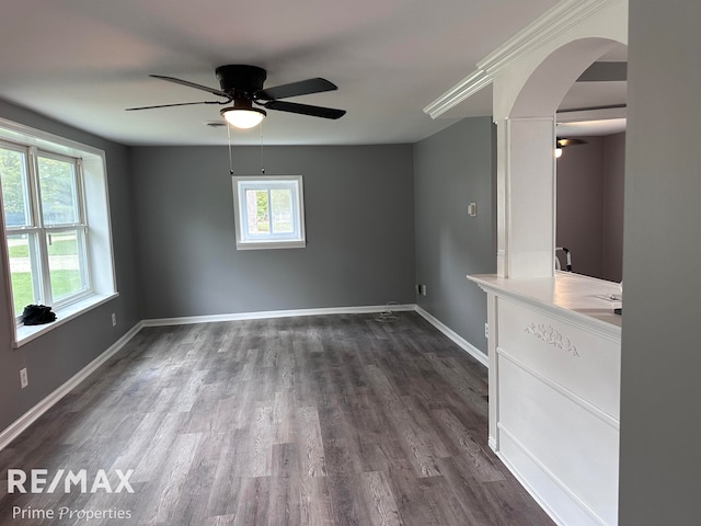 unfurnished room featuring ceiling fan and dark hardwood / wood-style flooring