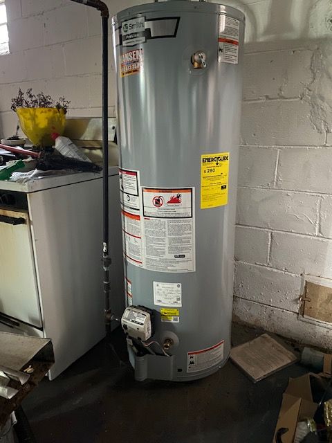 utility room with water heater