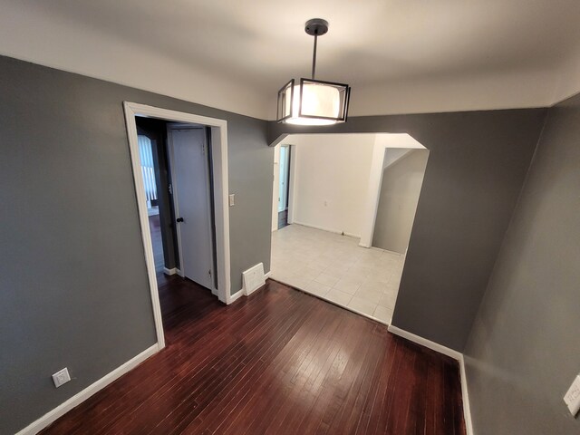 15836 Patton St, Detroit, MI 48223 - unfurnished dining area featuring hardwood / wood-style floors and baseboards