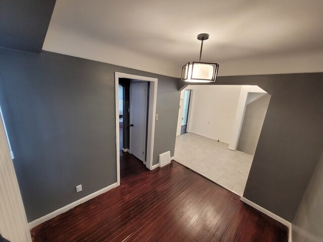 15836 Patton St, Detroit, MI 48223 - unfurnished dining area featuring hardwood / wood-style floors and baseboards