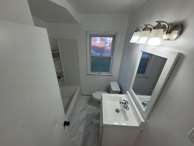 15836 Patton St, Detroit, MI 48223 - full bathroom with toilet, a tub, baseboards, and vanity