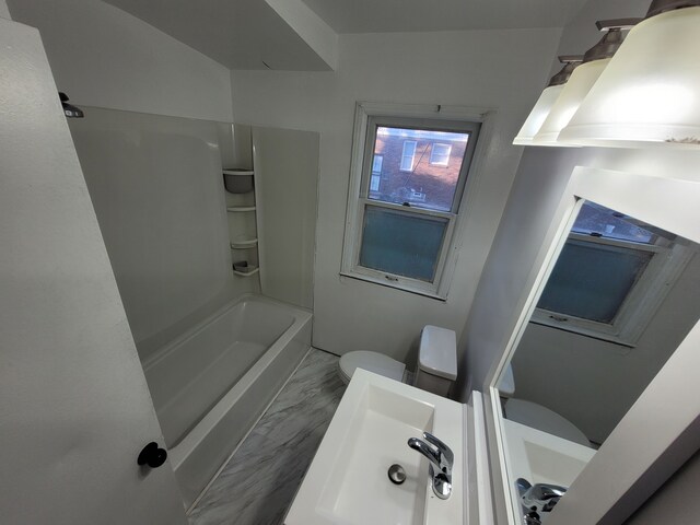 15836 Patton St, Detroit, MI 48223 - full bathroom featuring bathtub / shower combination, marble look tiles, and toilet