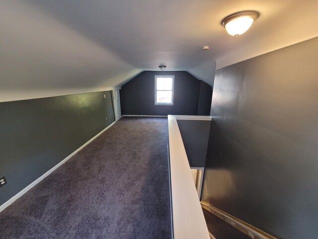15836 Patton St, Detroit, MI 48223 - bonus room featuring lofted ceiling, dark carpet, and baseboards