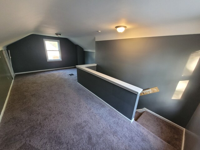 15836 Patton St, Detroit, MI 48223 - additional living space with carpet floors, lofted ceiling, and baseboards