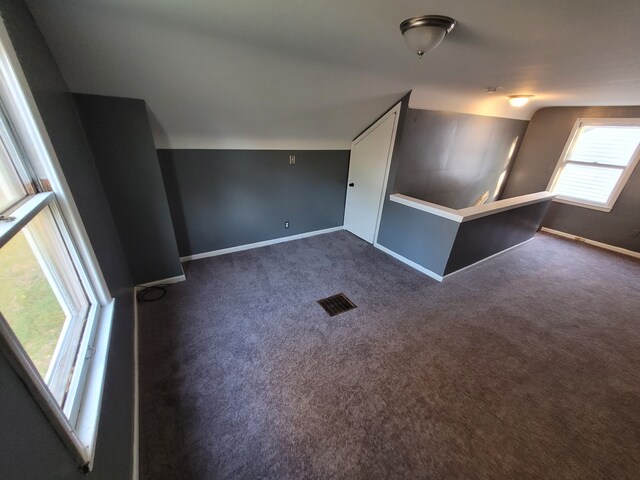 15836 Patton St, Detroit, MI 48223 - additional living space with vaulted ceiling, baseboards, and carpet