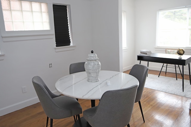 dining area featuring hardwood / wood-style floors