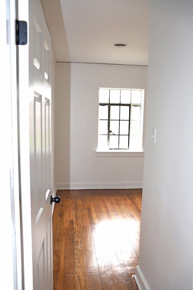 spare room with hardwood / wood-style flooring