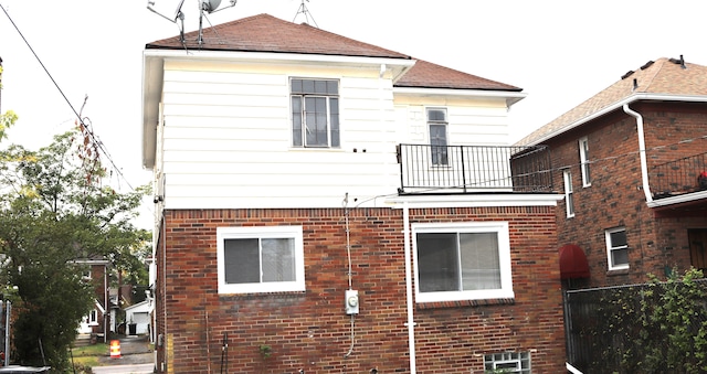 back of house with a balcony