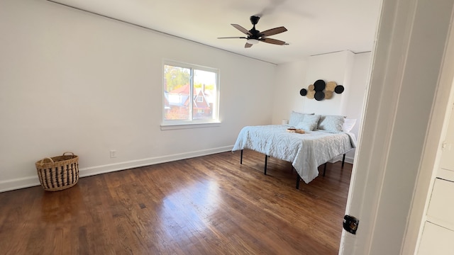 bedroom featuring ceiling fan and dark wood-type flooring