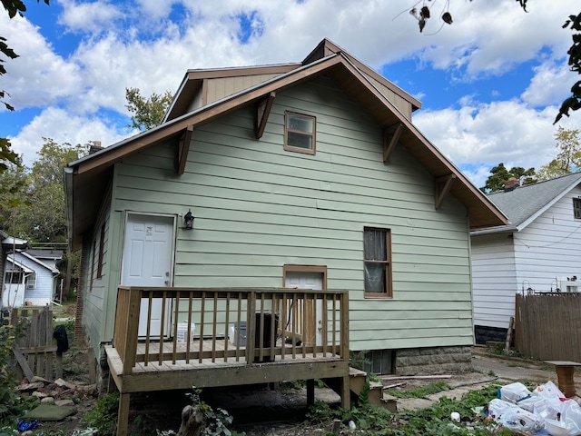 rear view of house featuring a deck