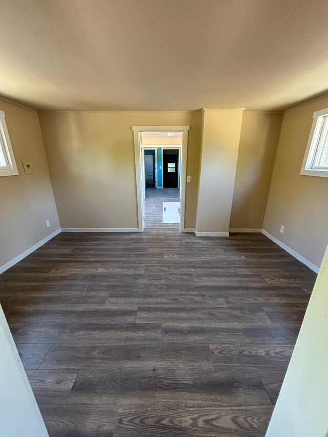 spare room featuring dark hardwood / wood-style floors