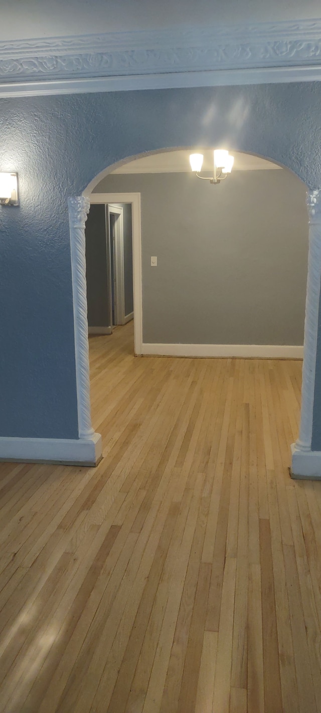 unfurnished room with light wood-type flooring