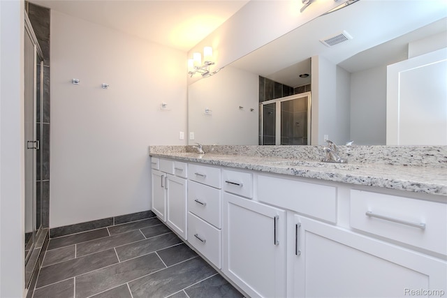 25535 Grandview Ln Unit 30, Novi, MI 48375 - bathroom with double vanity, a shower stall, and tile patterned flooring