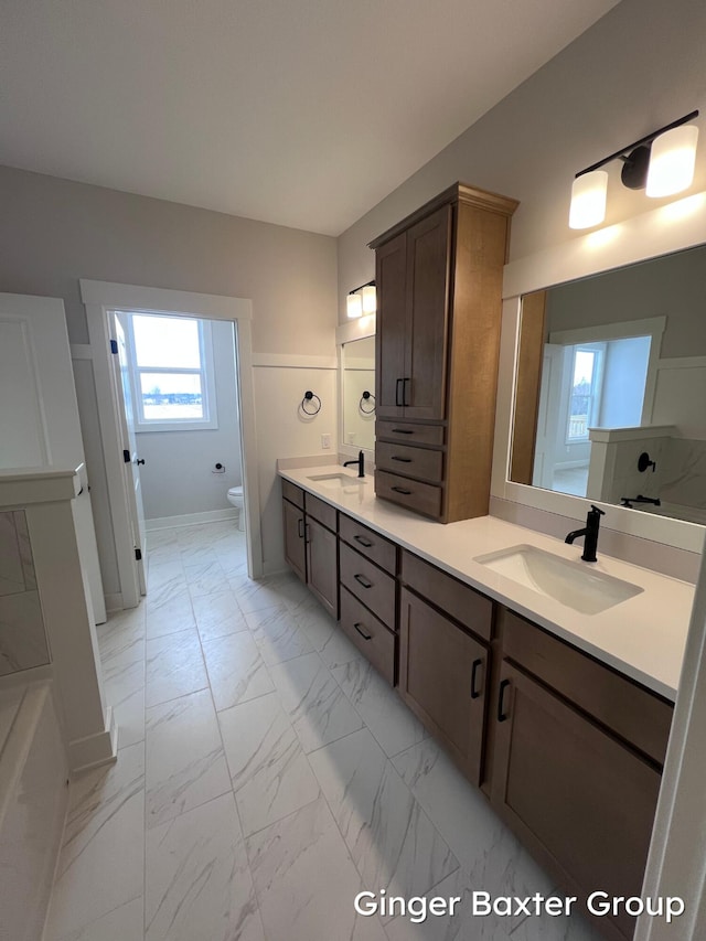 bathroom with vanity and toilet