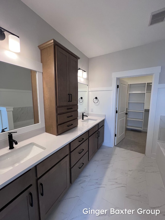 bathroom featuring vanity and a bathing tub