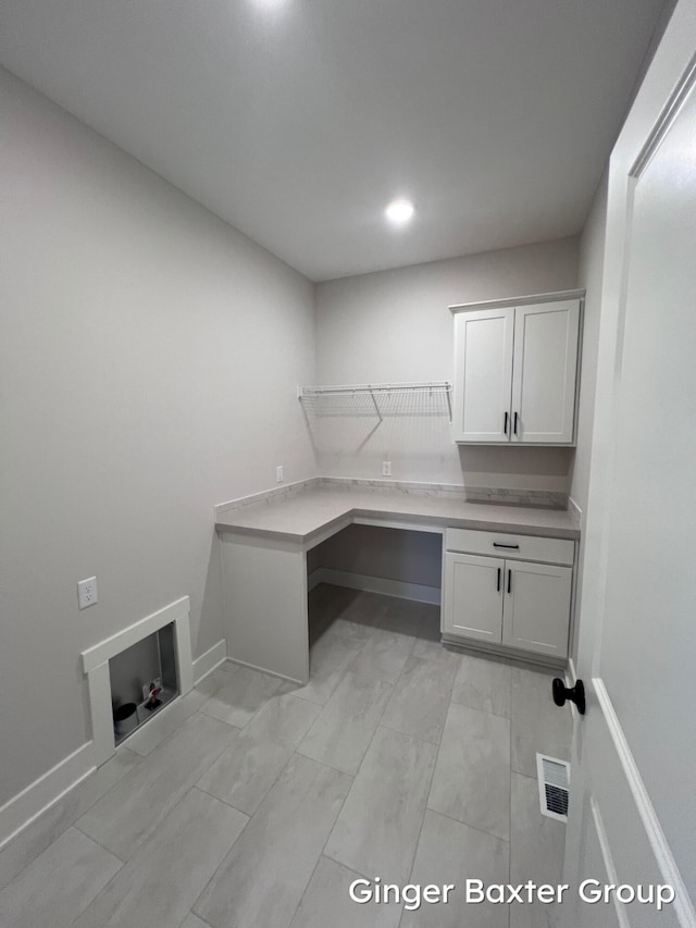 laundry room with cabinets and hookup for a washing machine