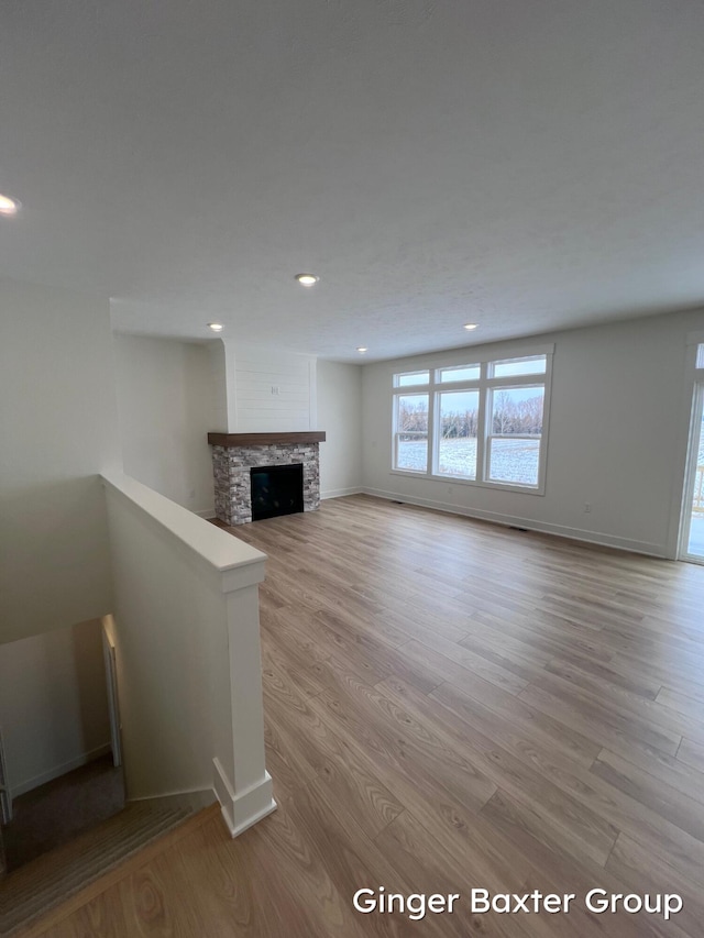 unfurnished living room with light hardwood / wood-style flooring