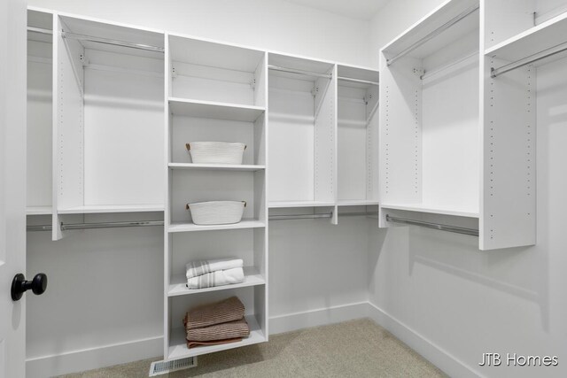 11376 Shoreline Dr Unit 115, Allendale, MI 49401 - walk in closet featuring visible vents and carpet flooring