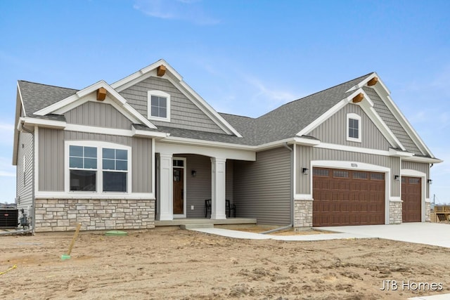 11376 Shoreline Dr Unit 115, Allendale, MI 49401 - craftsman inspired home featuring stone siding, driveway, and roof with shingles