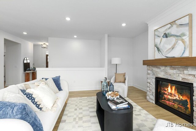 11376 Shoreline Dr Unit 115, Allendale, MI 49401 - living area featuring a stone fireplace, wood finished floors, and recessed lighting