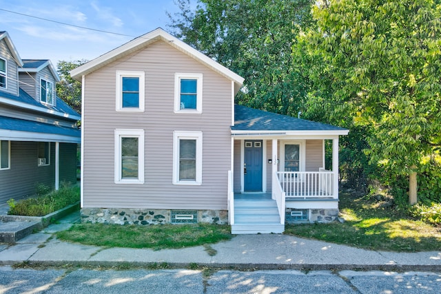 view of front of property featuring covered porch